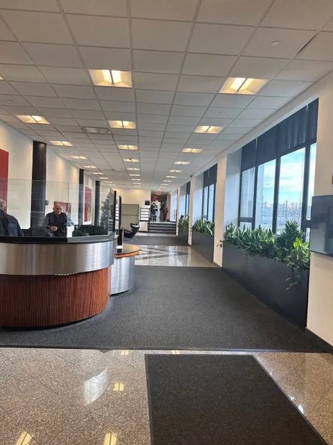 The lobby at 30-30 Northern Blvd, front desk ahead