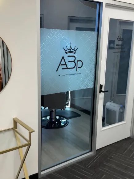 Suite 131: the ABp crown etched on the glass door